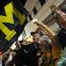 Michigan fans Ron and Terry Penpraze, of Fla., cheer and wave a Michigan flag as the band marches by during the Outback Bowl New Year's eve parade in Ybor City, Fla. on Monday night. Melanie Maxwell I AnnArbor.com